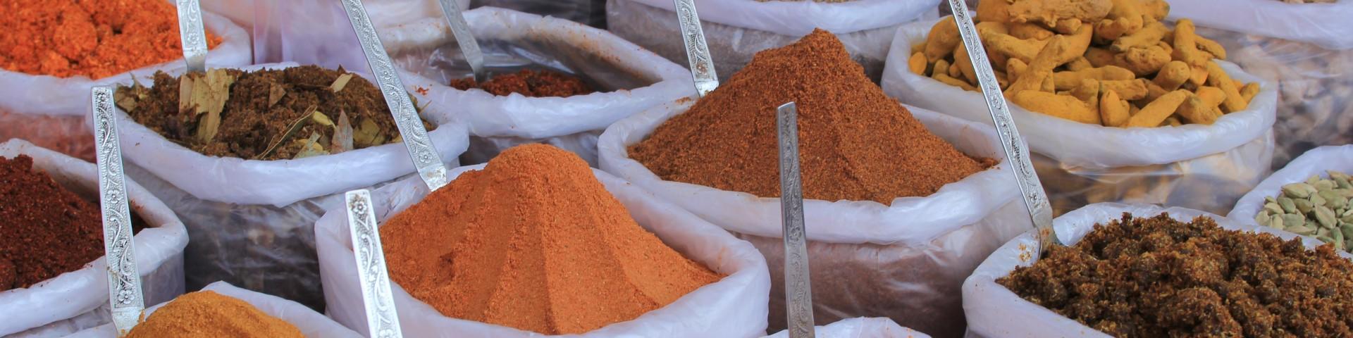 Containers filled with various dried spices and herbs