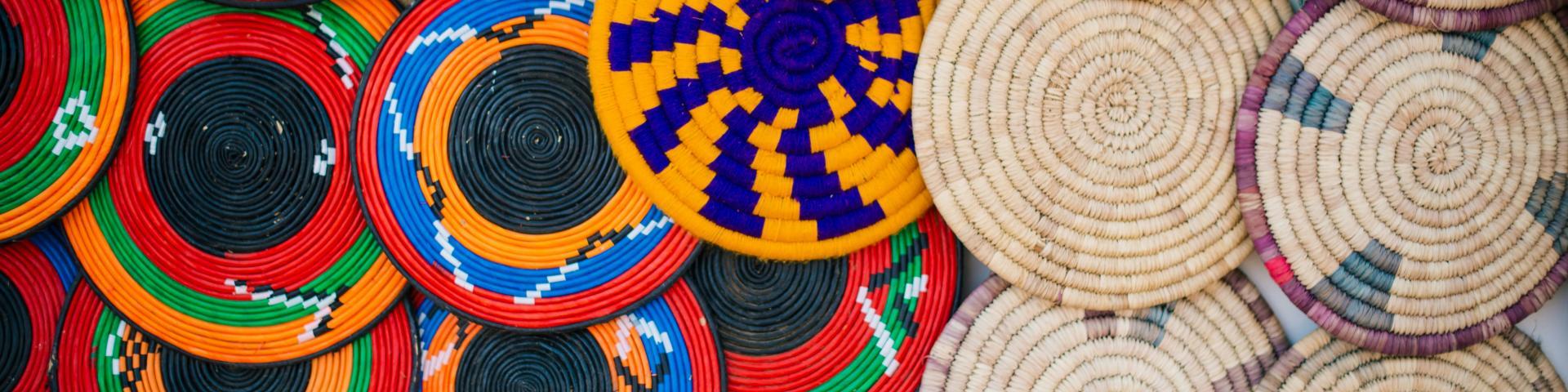 A range of colourful basket lids viewed from above