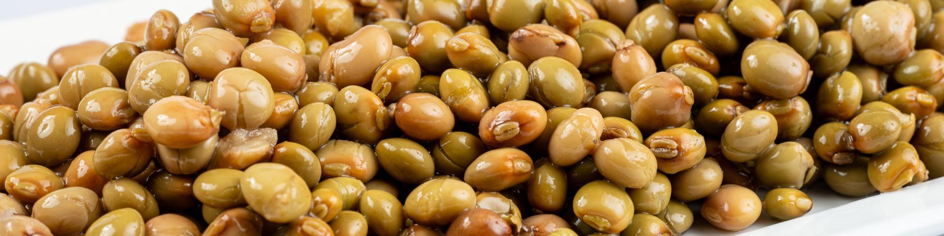 Close-up of fresh pigeon peas against a white background