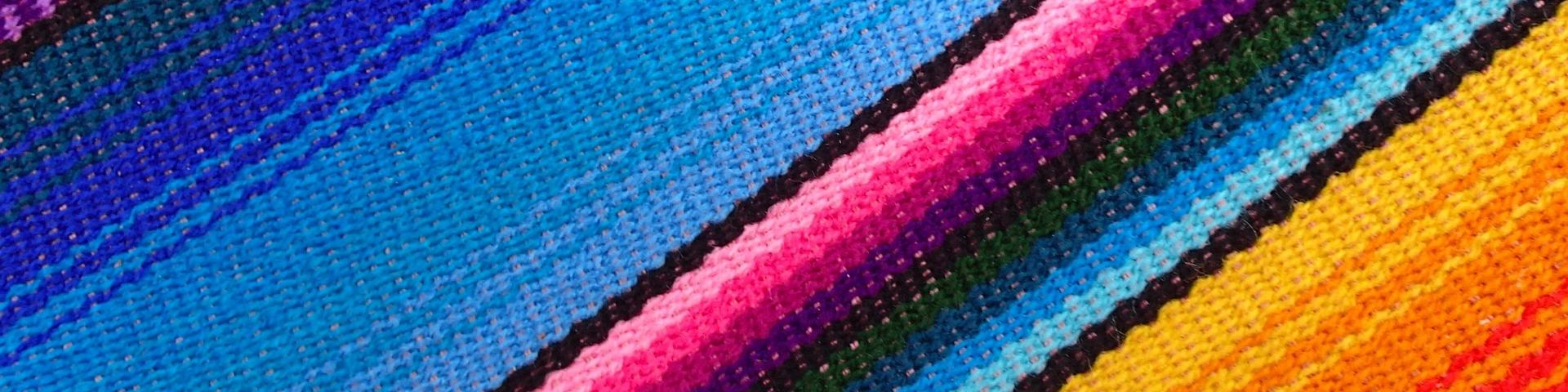 Hammock fabric with a colourful stripe pattern.