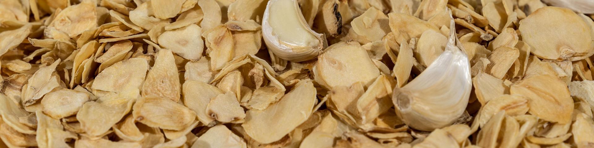 Slices of dried garlic mixed with garlic cloves