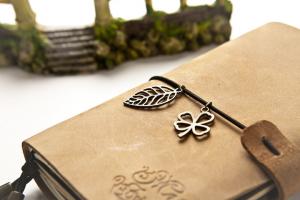 Notebook with a leather cover and metal bangles