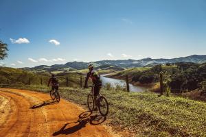 Two adventure travellers cycling in the mountains