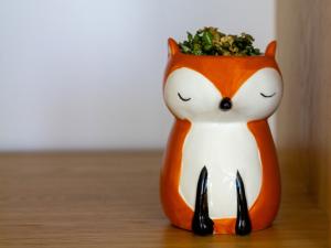 Fox figurine that functions as a plant pot