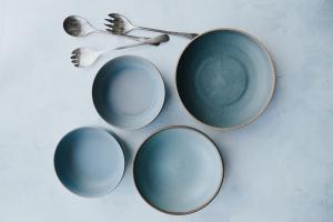 Metal salad servers with ceramic bowls