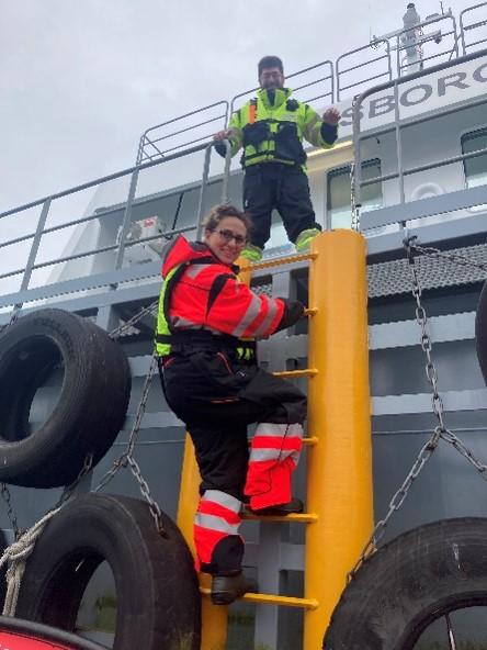 Employees wearing safety equipment such as boots, life vests and gloves 2