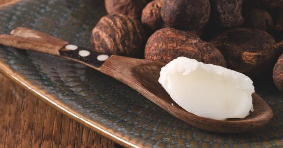 Shea butter on a wooden spoon