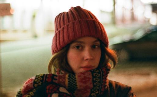 Woman with knitted beanie and scarve