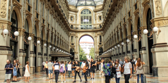 People walking around inside an old shopping arcade