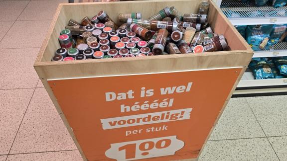 Private-label-packed spices and herbs promoted at €1 per item in a Dutch supermarket