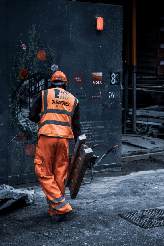 Worker wearing bright orange safety gear