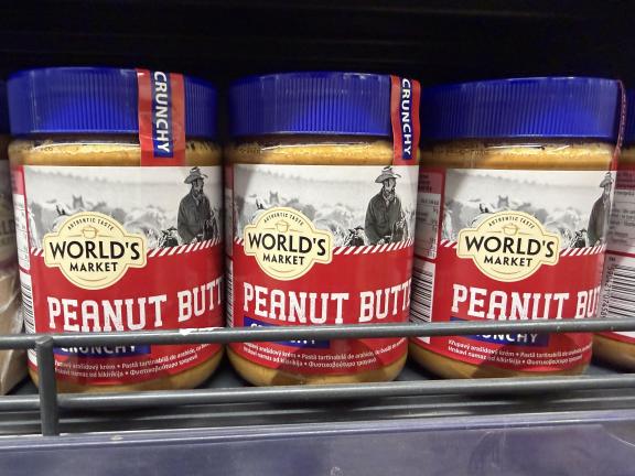 Crunchy peanut butter in a glass jar