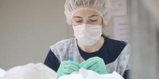 Woman making PPE