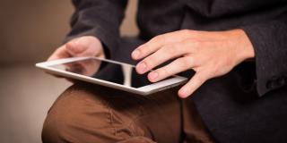 Man reading on tablet