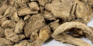 Close-up of dried ginger against a white background