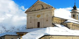 Historic church in snowy Italian Alps