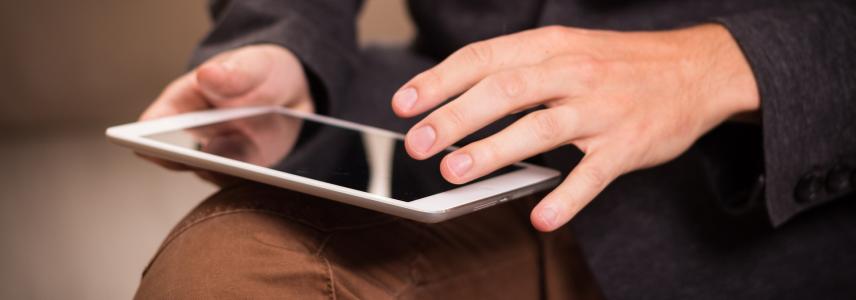 Man reading on tablet
